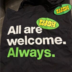 Lush Black Tote with Green and White Slogan